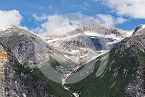Snow on Mountaintops in Tracy Arm Fjord Alaska photo