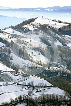 Snow covered mountainside on a sunny winter day