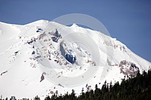 Snow covered Mt. Shasta Peak with human face