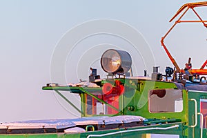 Snow-covered old electric locomotive. Details located on the cabin close up