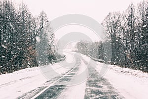 Snow-covered Open Road During A Winter Snowstorm. Adverse Weather