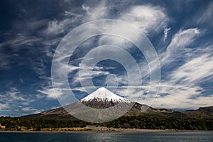 Osorno Volcano, a conical stratovolcano with dramatic cloudy blue sky in Los Lagos Region, Patagonia, Chile photo