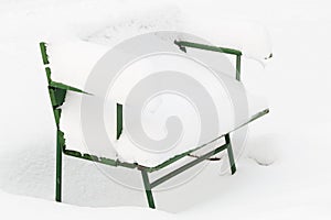 Snow-covered park bench