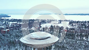 Snow-covered park and water tower in Espoo, Finland