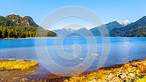 Snow covered peaks of the Coast Mountains surrounding the Pitt River and Pitt Lake in the Fraser Valley of British Columbia Canada