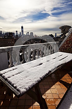 Snow Covered Picnic Table & New-York Skyline