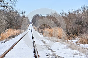 Snow Covered Railroad Tracks in Country