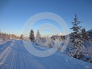 Snow covered road and Himingen in the Lifjell mountain plateau in winter