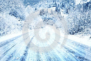 Snow covered road in the mountains on snowy day