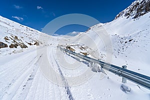 Snow covered road to Khunjerab border between China and Pakistan photo