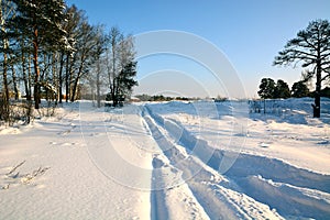 Snow-covered road to the little house