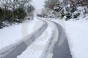 Snow covered road, winter transportation concept