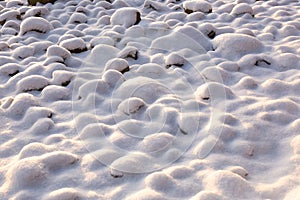 Snow covered rocks texture, bumpy soft snow texture