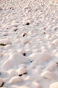 Snow covered rocks texture, bumpy soft snow texture