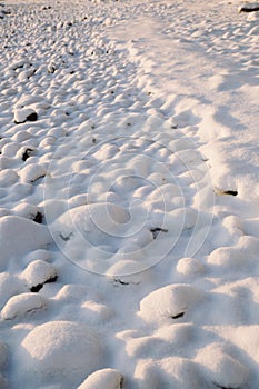 Snow covered rocks texture, bumpy soft snow texture