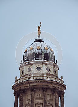 Snow covered roof of New Church also called Deutscher Dom or German Cathedral and French Catheral on Gendarmenmarkt in