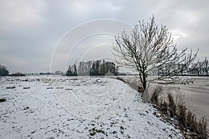 Snow covered shore and a frozen lake