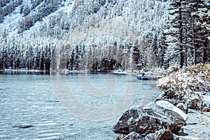 Snow covered shore of a mountain lake