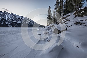 Snow Covered Shore of a Mountain Lake
