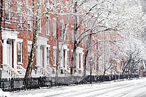 Snow covered sidewalks along Washington Square Park in New York City