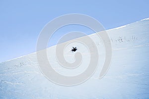 A snow-covered smooth mountain slope.