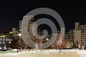 Snow-covered square in Moscow city at winter night