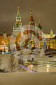 Snow Covered St. Basilâ€™s Cathedral and Spasskaya Tower in Winter Evening