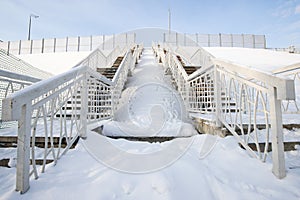 snow-covered steps of a high staircase in the city