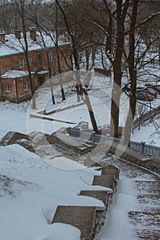 Snow covered steps in a park in Tallinn in snowfall. Estonia