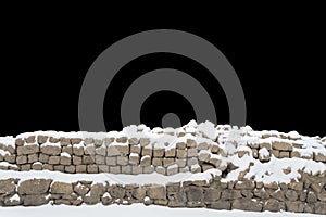 Snow covered stone wall