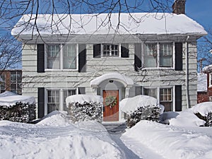 Snow covered suburban house