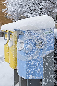 Snow covered Swedish letterboxes