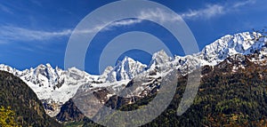 The snow covered Swiss Alp mountain range Sciora viewed from the village Soglio