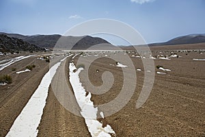 Snow covered track in Farallon de Tara, Atacama Desert, Bolivia