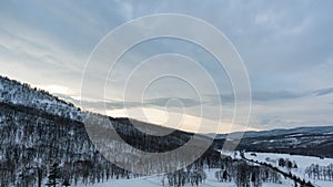 Snow covered trees on winter snow mountains. Winter snow mountain forest landscape