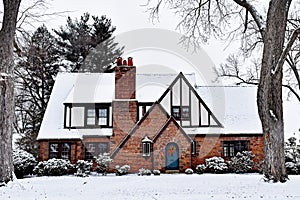 Snow Covered Tudor House with Christmas Wreath
