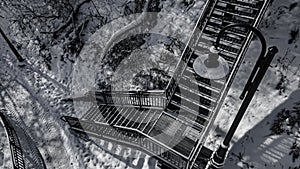 Snow covered urban stairs with snow in black and white