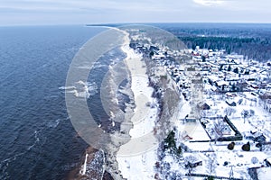 Snow covered village in Baltic sea shore