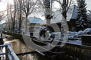 Snow covered water mill in the center of Lyss, Switzerland