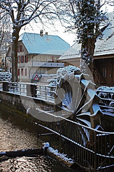 Snow covered water mill in Lyss Switzerland