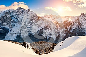 Snow-covered winter Dolomite Alps at sunset, Italy