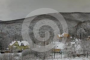 Snow-covered winter village in the Carpathian mountains