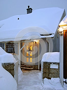 Snow-covered winterly house entrance photo