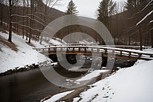 A snow-covered wooden bridge over a frozen stream