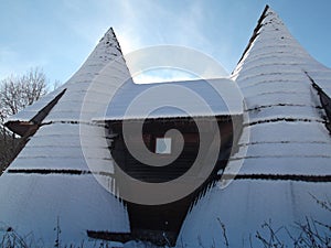 The Snow covered wooden bungalow photo