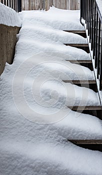 Snow covered on wooden stairs house in winter. Snow covered steps
