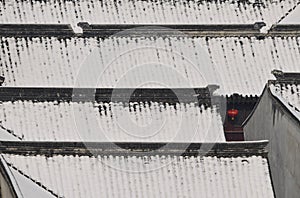 Snow covering traditional roof