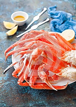 Snow crab legs plate with lemon and butter sauce