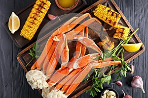 Snow Crab legs served with corn cobs