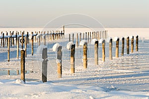 Snow Decorated Alpine Lake Piers